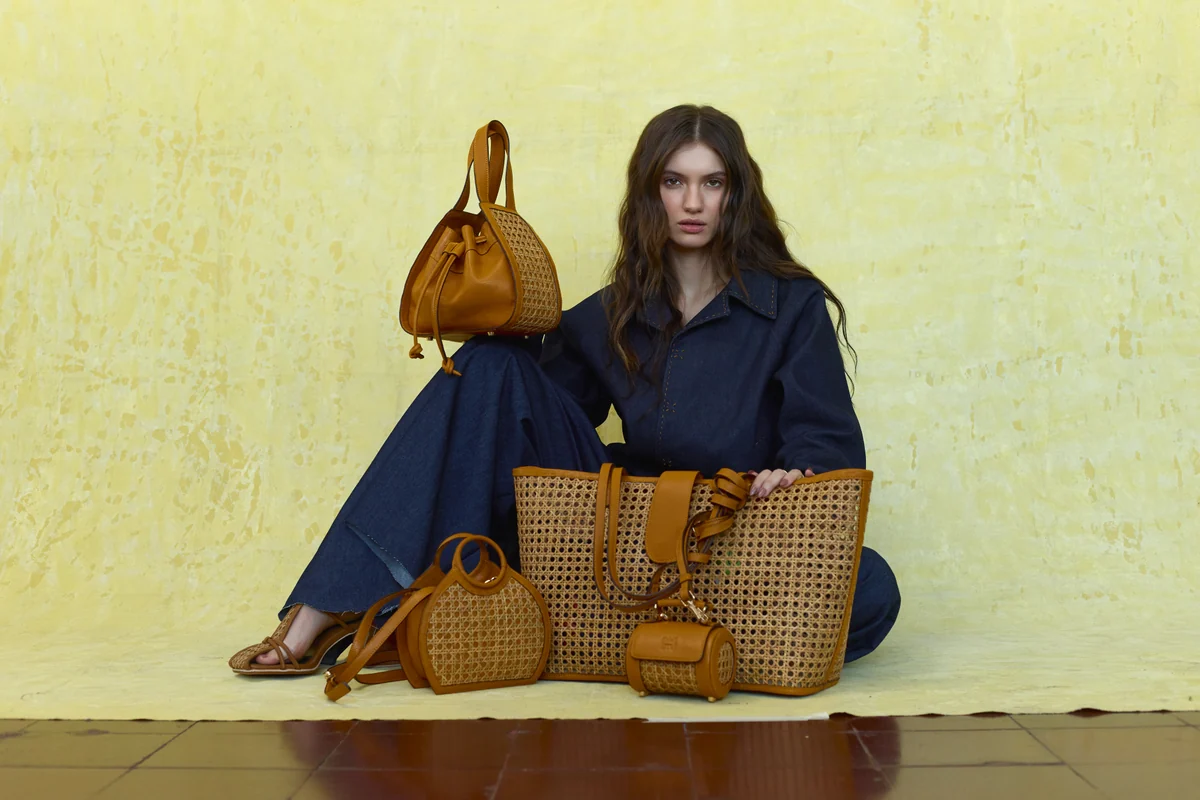 ORIAS campaign: navy tailoring with handcrafted tan solihiya bags