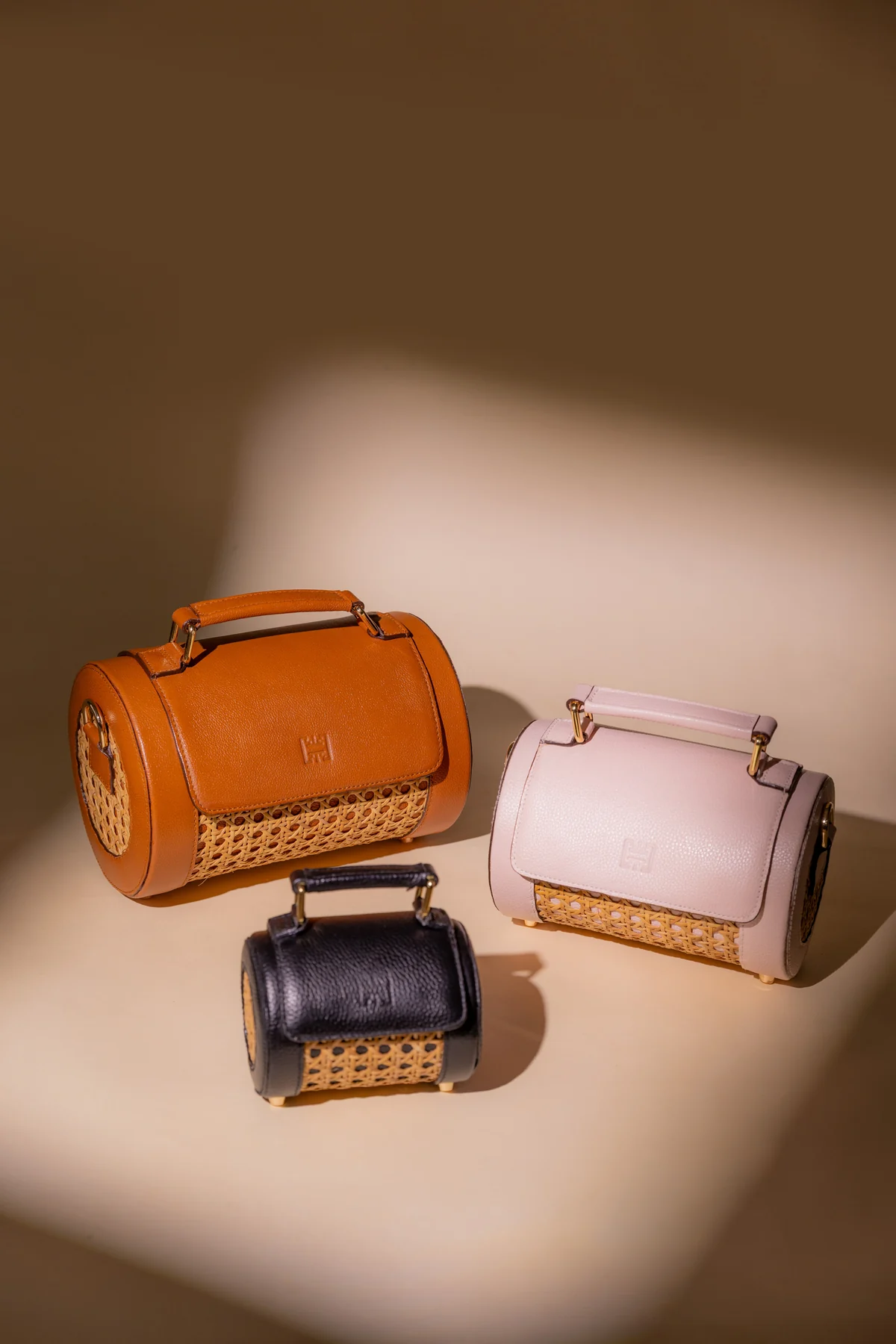 Orange, pale pink and black ORIAS handcrafted bags